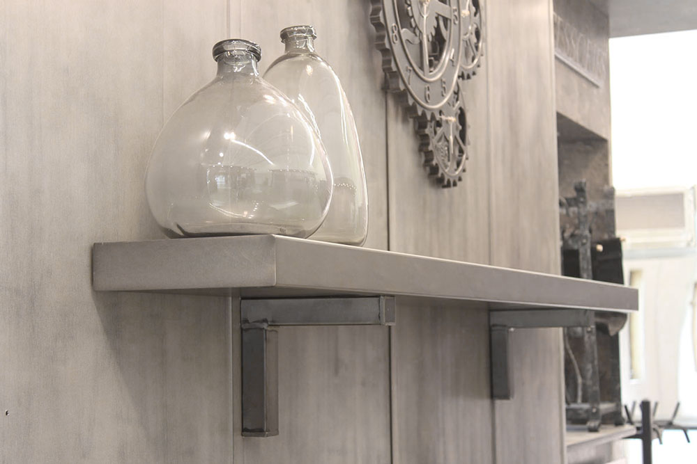 Stoll steel floating shelf on a fireplace wall