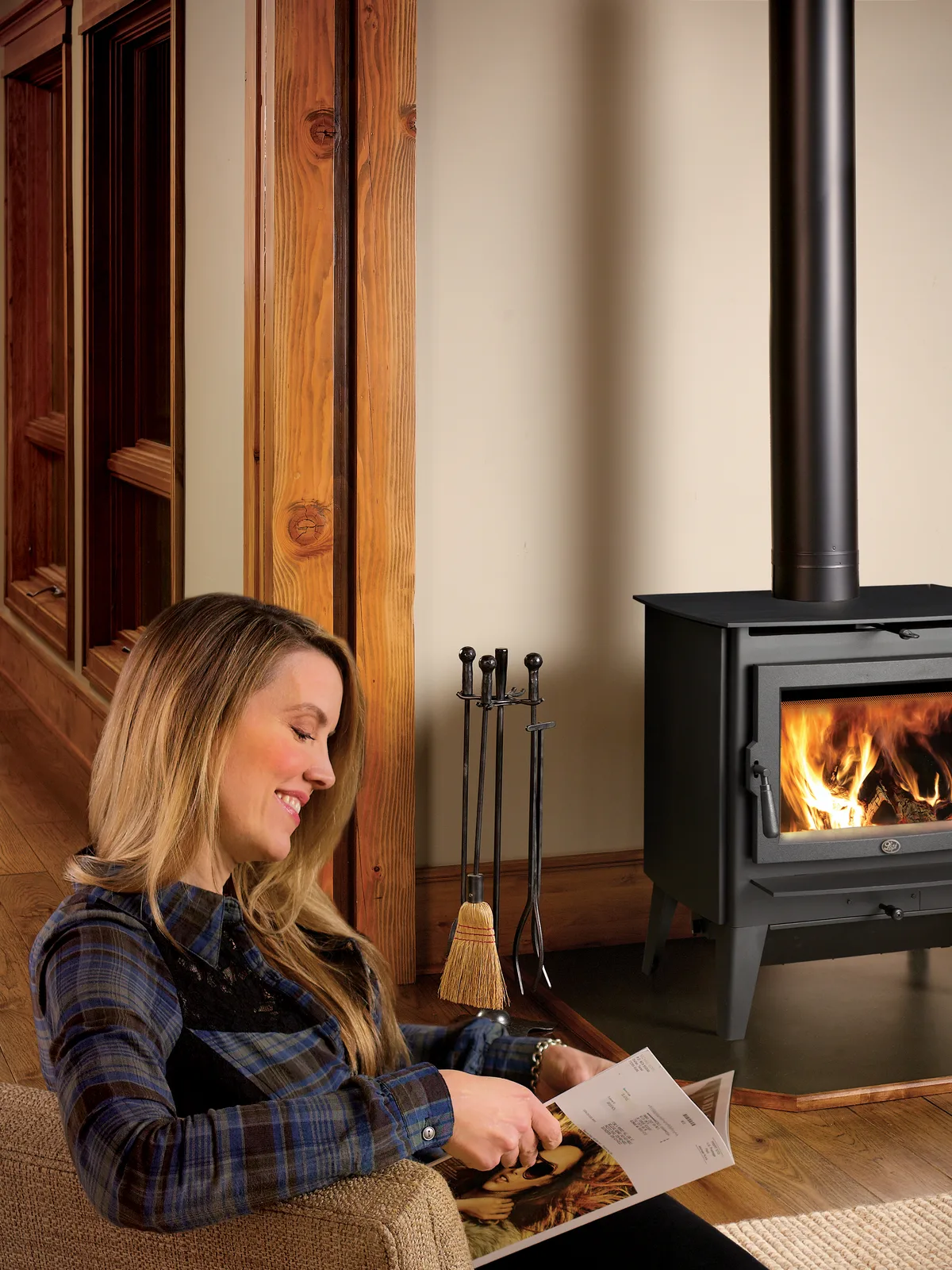 Reading beside a Lopi wood stove on a winter evening